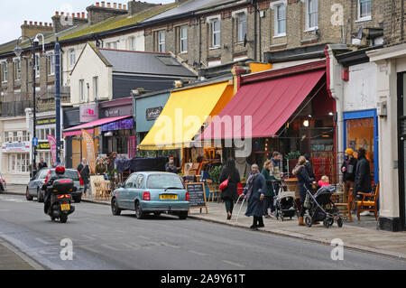 Second hand shops on Church Road in Crystal Palace, south London, UK. Shops selling used furniture, clothes, records and household bric-a-brac. Stock Photo