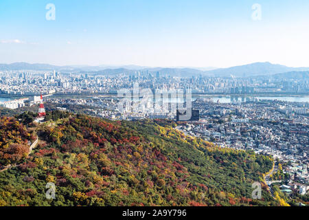 travel to South Korea - aerial view of overgrown Namsan mountain and Seoul city from Seoul Tower on sunny autumn day Stock Photo