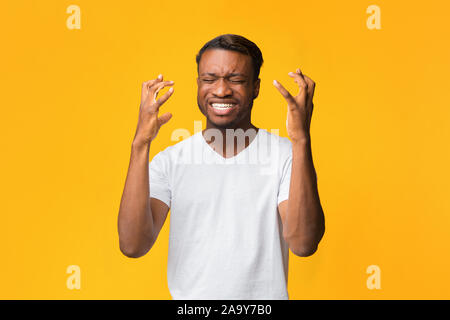 Frustrated Afro Man Gesturing With Hands Expressing Disappointment, Studio Shot Stock Photo