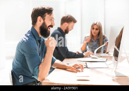 happy businessman looking at his PC screen. Stock Photo