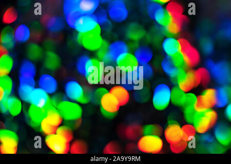 Blurred defocused multi color lights as Christmas decorations background. Party concept. Stock Photo