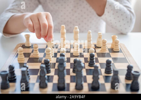a girl learn how to play chess game Stock Photo