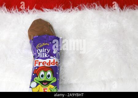 Cadbury Dairy Milk Freddo Chocolate Bar opened wrapper from Cadbury Festive Favourites 2019 with copy space Stock Photo