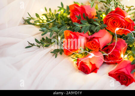 Composition: red roses with boxwood and garlands Stock Photo