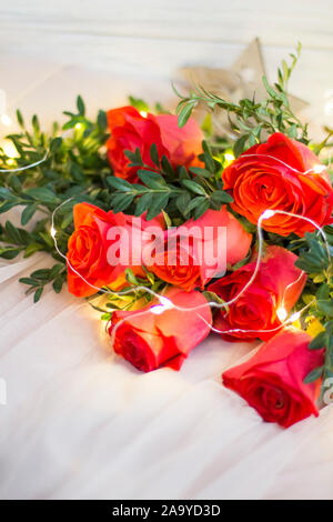 Composition: red roses with boxwood and garlands Stock Photo