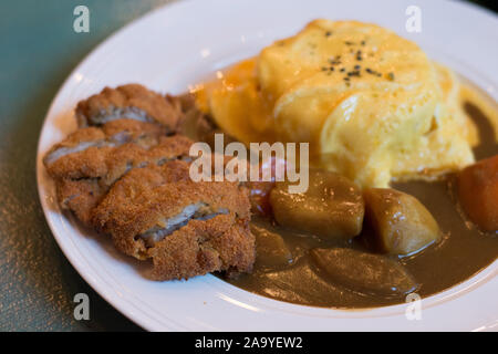 Japanese chicken curry with potatoes and egg omelette rice Stock Photo