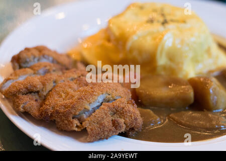 Japanese chicken curry with potatoes and egg omelette rice Stock Photo