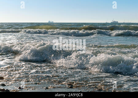 sunset on the sea, sea waves red from sunlight Stock Photo