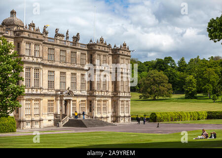 Family seating in the lawn garden in Longleat House, Wiltshire, England, UK Stock Photo