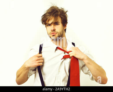 Bearded man, short beard. Caucasian stylish manager with moustache in red tie, shirt with suspenders posing in studio isolated on white background Stock Photo