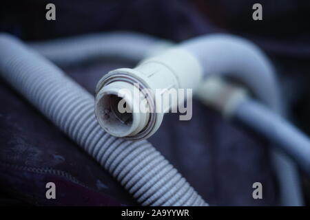 Old dirty vacuum cleaner hose close up Stock Photo