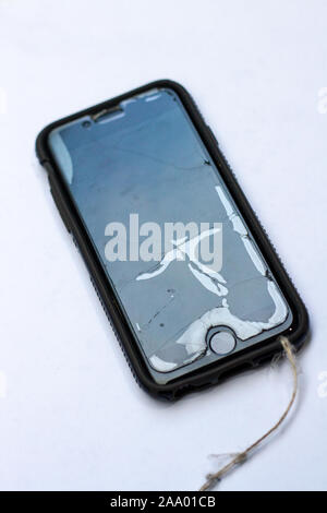 Broken and cracked screen protection on an Iphone Stock Photo