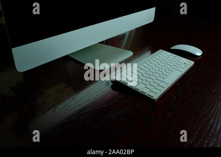 Computer with keyboard and mouse in a clean desktop Stock Photo