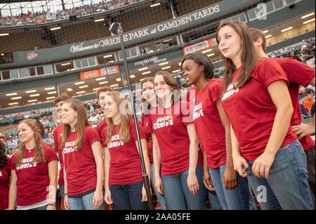 A musical group from the Johns Hopkins University in Baltimore, Maryland sings during a Baltimore Orioles Major League Baseball game, May 8, 2009. From the Homewood Photography collection. () Stock Photo