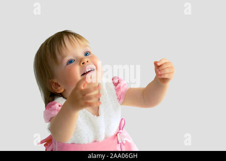 Little girl stretches her arms to mom. Stock Photo