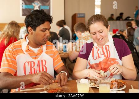 Students participate in a Crab Feast, with Maryland blue crabs, an annual tradition at the Johns Hopkins University in Baltimore, Maryland, May 15, 2009. From the Homewood Photography collection. () Stock Photo