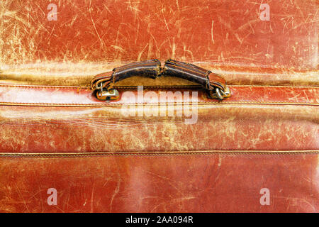 Old shabby handle of a leather briefcase. Old Leather Texture Stock Photo