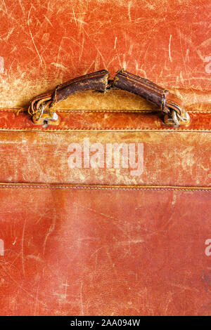 Old shabby handle of a leather briefcase. Old Leather Texture Stock Photo