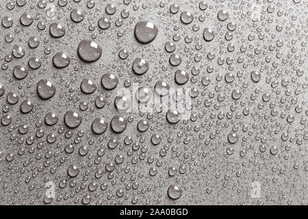 Background of shining water drops on silvery surface, macro Stock Photo