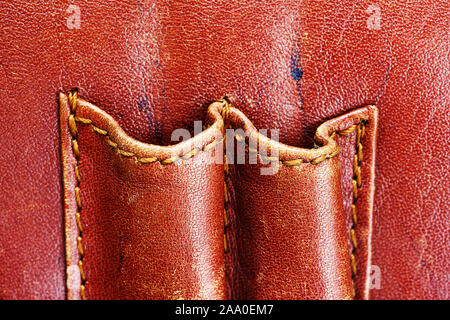 Pockets for pens in old a briefcase. Detail of an old leather bag briefcase close up Stock Photo