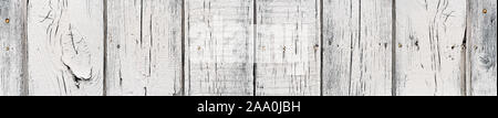 White color timber background, close up view. Painted wooden planks aged by time. Wide angle natural background with great texture, many knots, seams Stock Photo