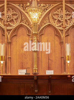Electric lamp on the choir stalls in the english medieval cathedral at Winchester, England. Stock Photo