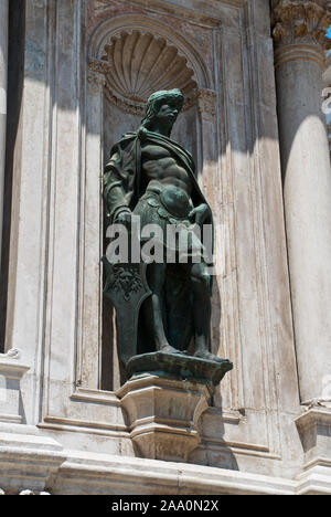 Venice, Italy: Bronze statue on the facade of Arco Foscari, Doge's Palace, courtyard,  Venice, Italy Stock Photo