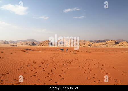 Desert trek towards Jabal Al Gaddar, Wadi Rum Protected Area, Aqaba Governorate, Jordan, Middle East Stock Photo
