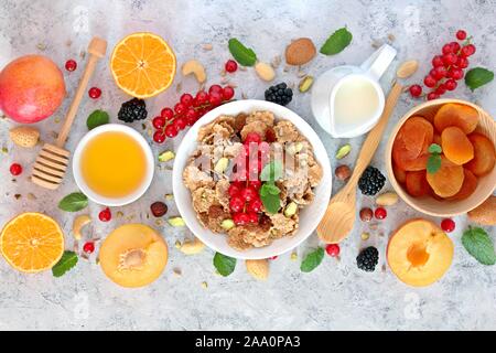 Healthy breakfast ingredients on light background. Top view with copy space. Stock Photo
