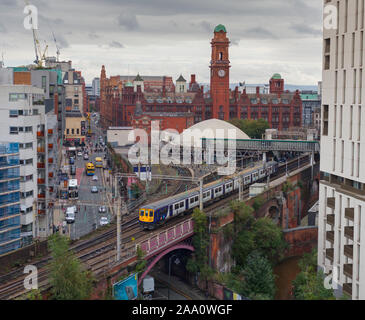 Arriva Northern rail class 319 electric train departing from Manchester Oxford Road station on the congested 2 track railway at Castlefield Manchester Stock Photo