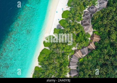 Aerial top down view with drone of an tropical exotic island paradise with turquoise crystal clear water and pure white sand beach Stock Photo