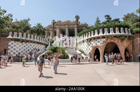 BARCELONA, SPAIN - JUL 19, 2018: Walking people in Park Guell. The Park Guell is a public park system composed of gardens and architectonic elements Stock Photo