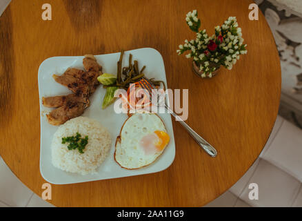 Omelet with rise and beef on a plate Stock Photo