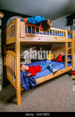 11 Year Old Boy Reading In Bed In Salento Italy Stock Photo