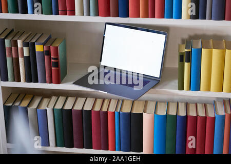 laptop and books from above with reflections Stock Photo
