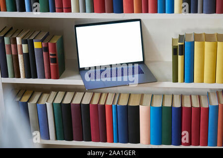 Computer and books from above with reflections Stock Photo