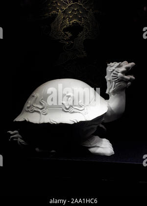 Chinese white porcelain Turtle in Budapest Hungary in a window on one of the main Shopping streets in the city Stock Photo