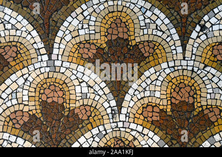 brown and gold ornate mosaic tile floor pattern Stock Photo