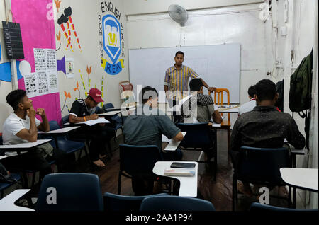 Saif Ullah teaching his adult students at the academy.Rohingya English Academy is a learning centre that offers free education to the Rohingya refugees both children and adults, it was founded by Saif Ullah a Rohingya citizen living in Malaysia and also an English tutor at the academy who receives no support from the government. Malaysia has more than 177,690 registered refugees and asylum seekers from Rohingya according to UNHCR statistic and 45,470 of them are children under the age of 18. Stock Photo