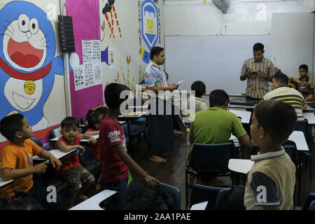 Kuala Lumpur, Selangor, Malaysia. 11th Nov, 2019. Saif Ullah in class with his students at the academy.Rohingya English Academy is a learning centre that offers free education to the Rohingya refugees both children and adults, it was founded by Saif Ullah a Rohingya citizen living in Malaysia and also an English tutor at the academy who receives no support from the government. Malaysia has more than 177,690 registered refugees and asylum seekers from Rohingya according to UNHCR statistic and 45,470 of them are children under the age of 18. (Credit Image: © Faris Hadziq/SOPA Images via ZUMA Stock Photo