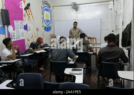 Kuala Lumpur, Selangor, Malaysia. 11th Nov, 2019. Saif Ullah teaching his adult students at the academy.Rohingya English Academy is a learning centre that offers free education to the Rohingya refugees both children and adults, it was founded by Saif Ullah a Rohingya citizen living in Malaysia and also an English tutor at the academy who receives no support from the government. Malaysia has more than 177,690 registered refugees and asylum seekers from Rohingya according to UNHCR statistic and 45,470 of them are children under the age of 18. (Credit Image: © Faris Hadziq/SOPA Images via ZUM Stock Photo