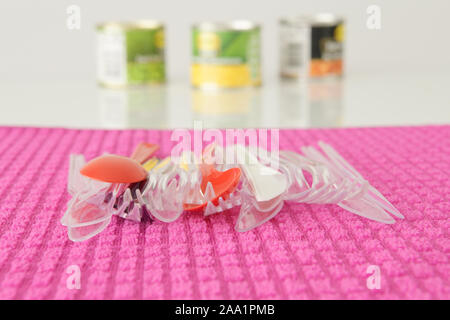 Close up, plastic pollution, disposable knives and forks on dishcloth, picnic outing, camping, cutlery, objects, eating out Stock Photo