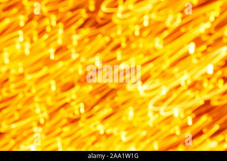 Futuristic blurred lights holiday monochrome background in yellow. Horizontal, soft focus Stock Photo