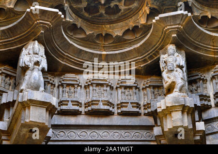 Small carved statues on the pillar and the wall of Kopeshwar Temple, Khidrapur, Maharashtra, India Stock Photo