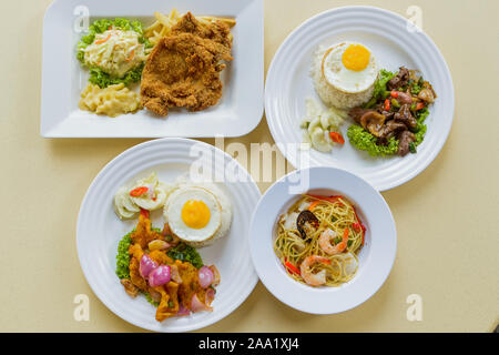 Flat lay view of various dishes of Asian Chinese Western food. Top down view. Stock Photo
