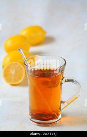 Eine Tasse Tee  mit Zitronen  / A cup of tea with lemons Stock Photo