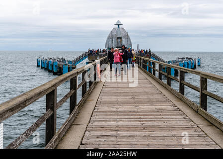 Sellin, Germany - August 1, 2019: Famous Sellin Seebruecke, Sellin Pier, a cloudy day of summer, Ostseebad Sellin tourist resort, Baltic Sea Stock Photo