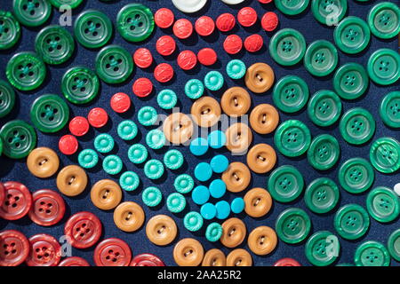 Background many buttons on the fabric. Stock Photo