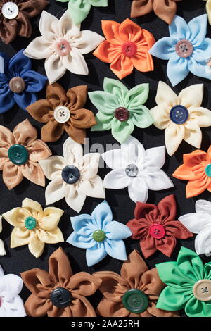 Background many buttons on the fabric in the form of a flower. Stock Photo