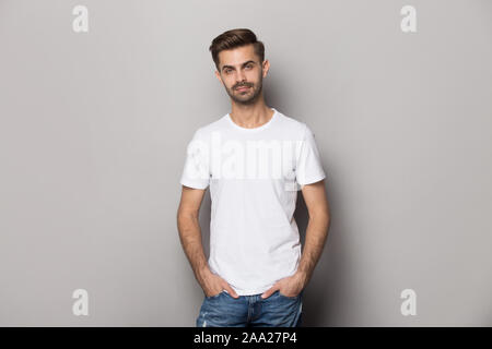 Portrait with smiling handsome bearded man in white t-shirt. Stock Photo